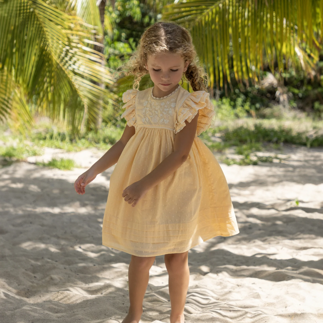 a girl wearing Georgia Dress in Vanilla