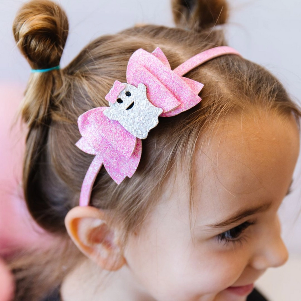 a girl wearing Girly Ghost Halloween Bow Headband