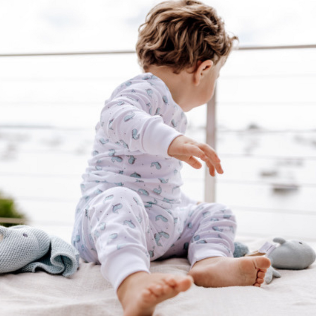 a baby wearing Happy Whale Pajama Set in Blue