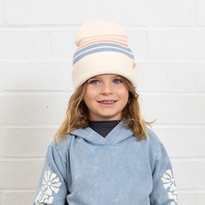 a girl wearing Head In The Clouds Beanie in Natural and Multi