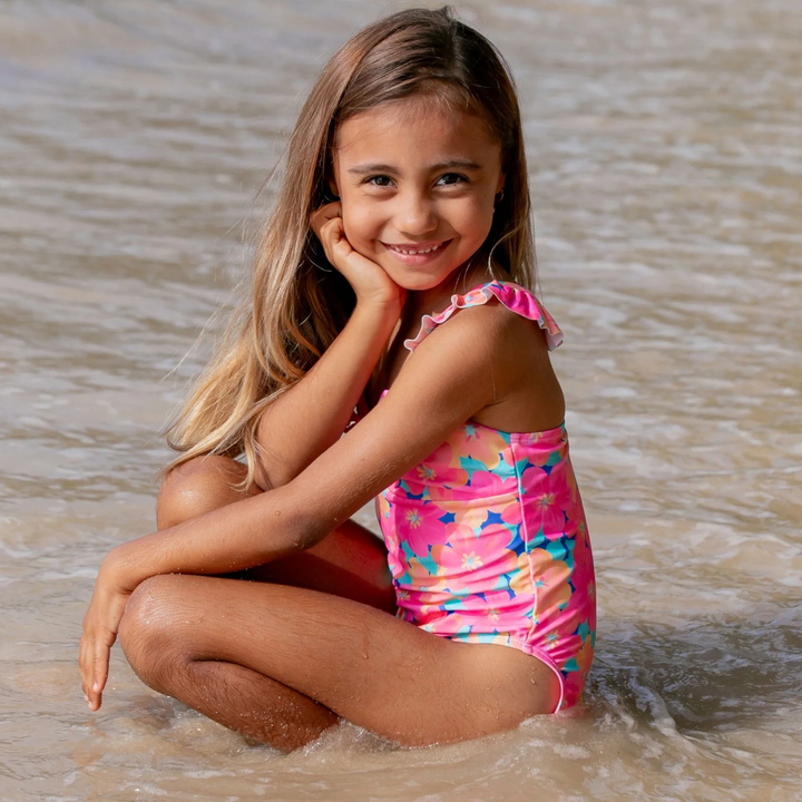 a girl wearing In a Cinch One Piece Swimsuit in Pink Carnation