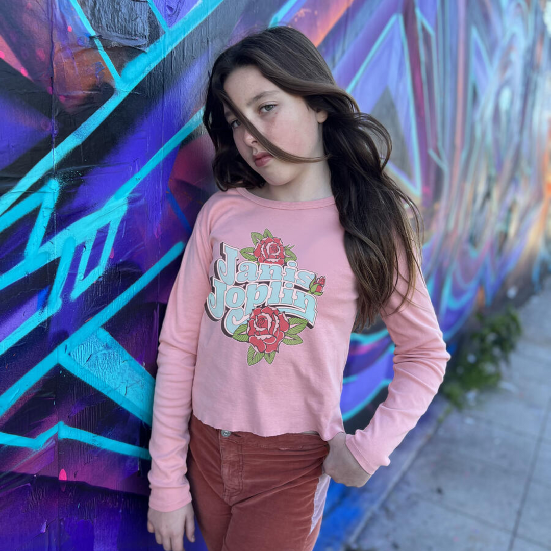 a girl wearing Janis Joplin Rose Long Sleeve Rib Tee in Blush