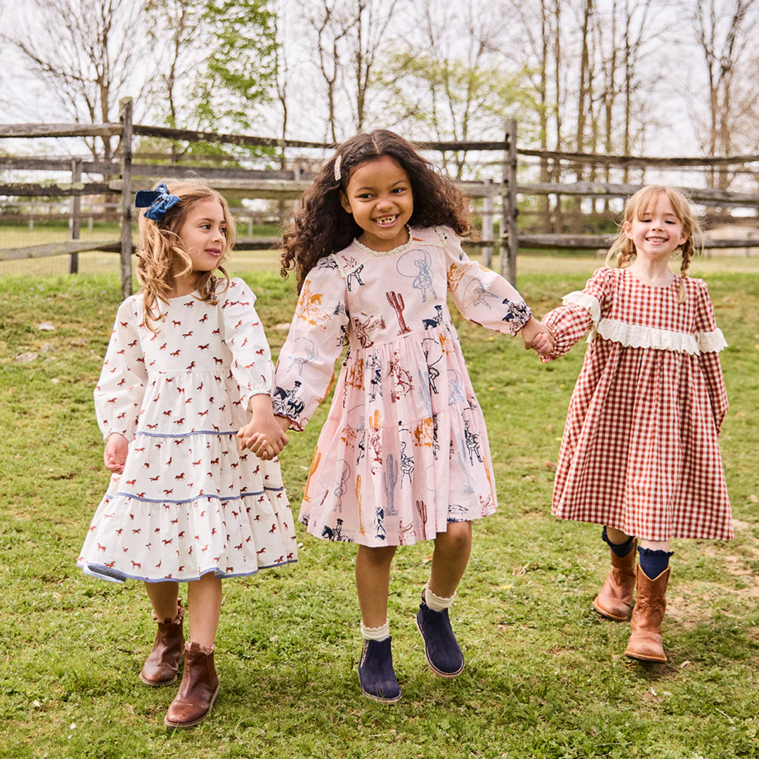 a girl wearing Julia Dress - Tiny Horses