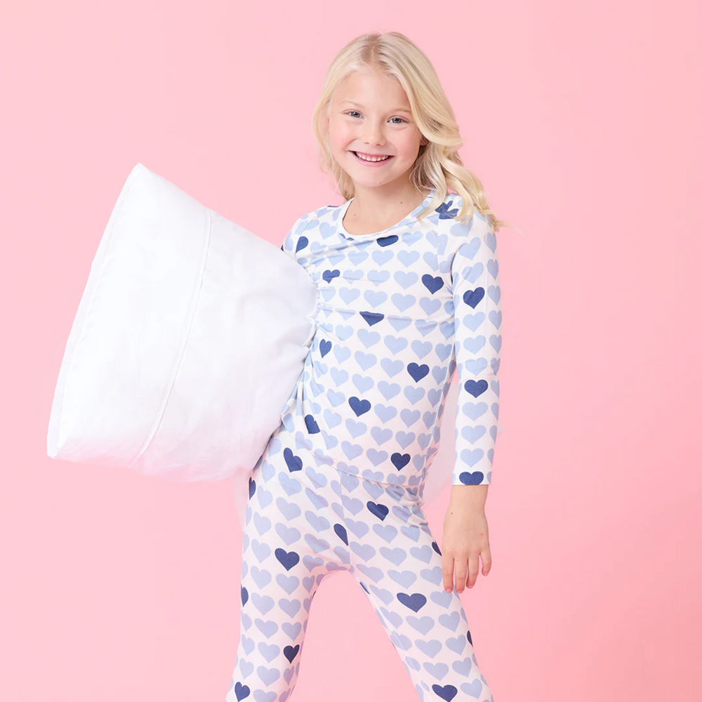 a girl wearing Bamboo PJ Set - Blue Tiny Hearts