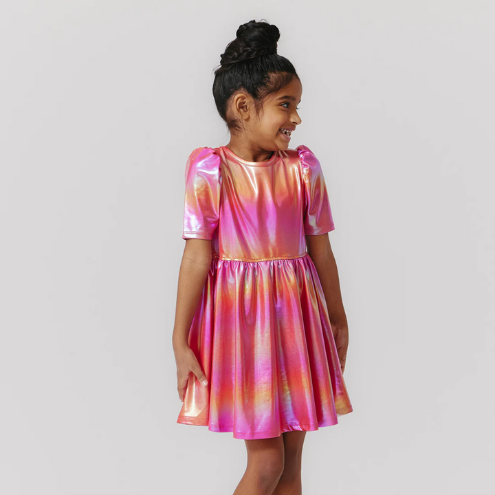 a little girl wearing Lame Laurie Dress - Rainbow Pink Lame