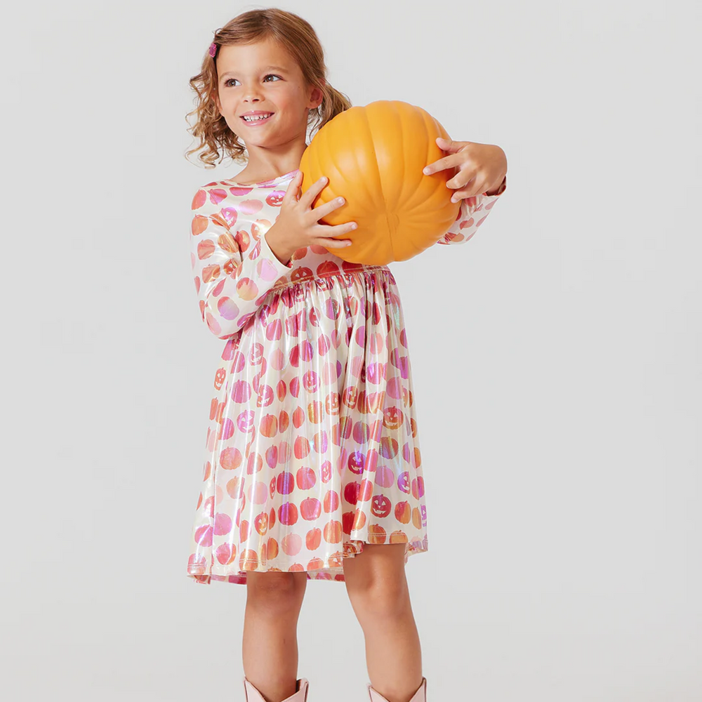 a girl wearing Lame Steph Dress - Pumpkins