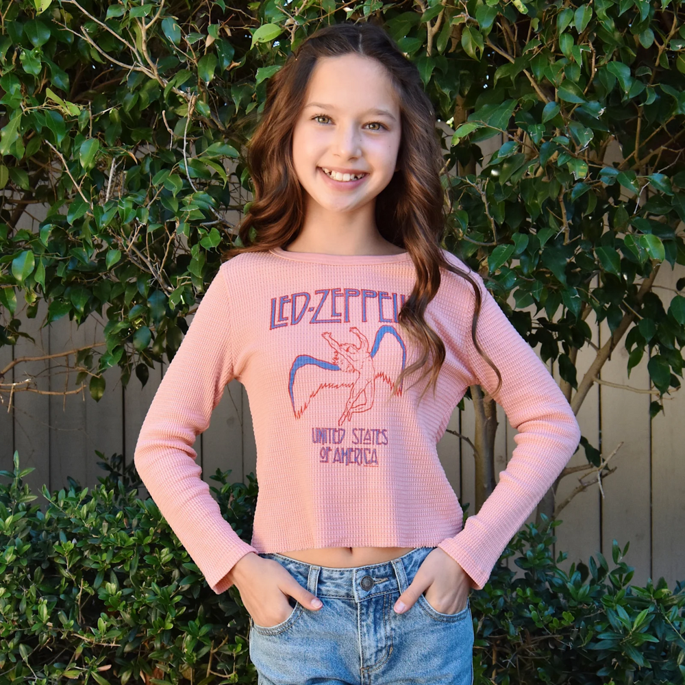 a girl wearing Led Zeppelin USA Long Sleeve Thermal Tee in Blush