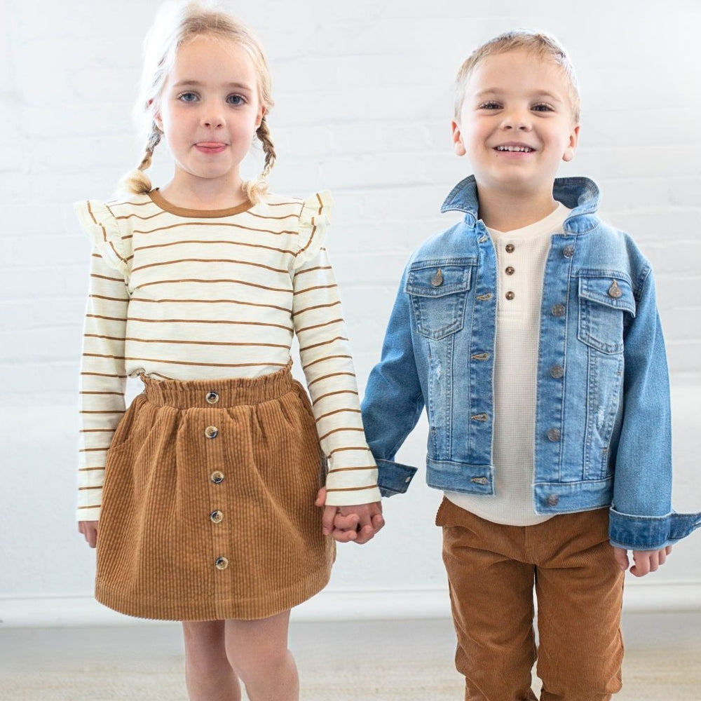 girl wearing kara top brown stripe