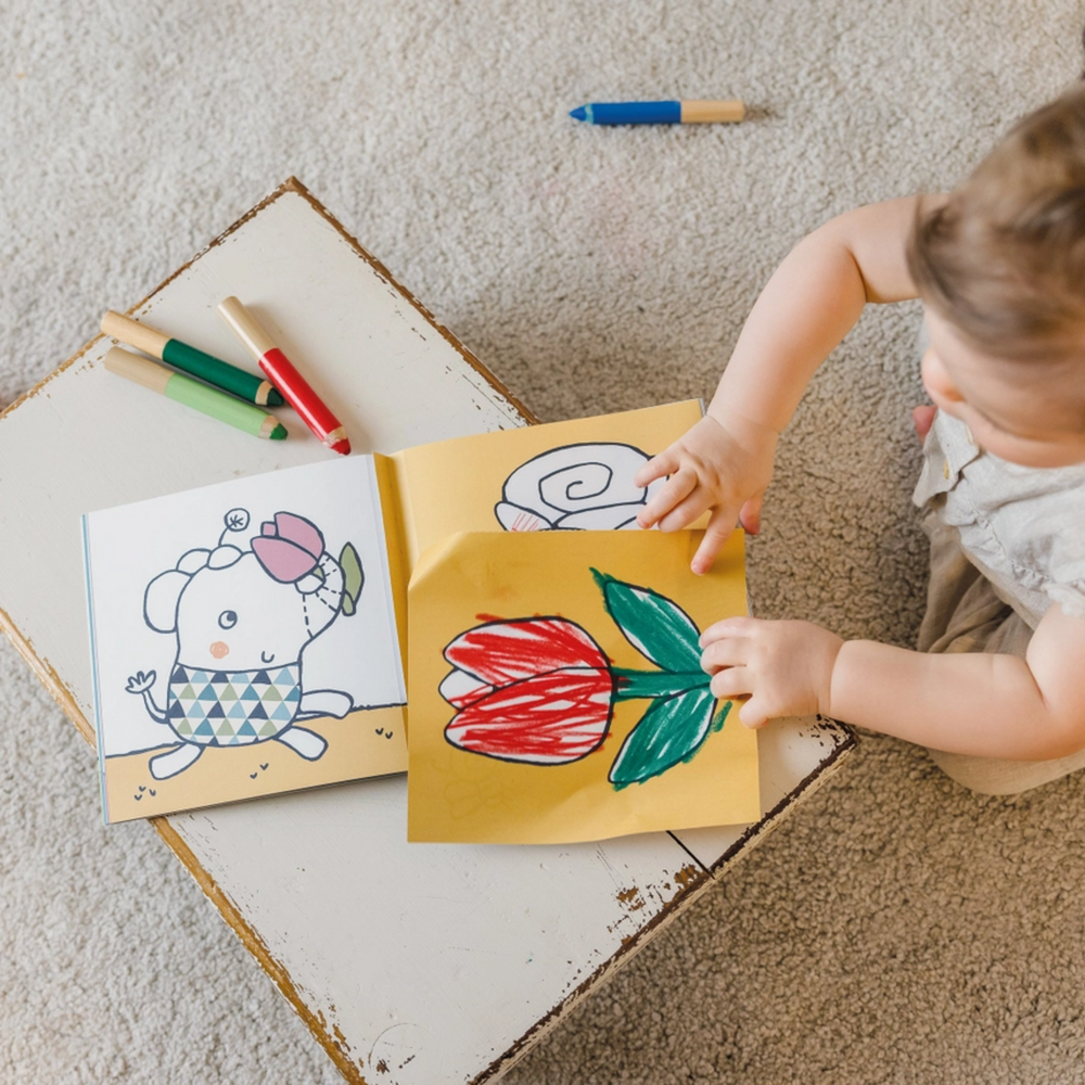 a baby playing Nature My First Coloring Bababook