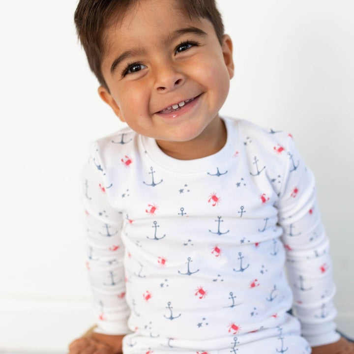 a boy wearing Nautical Crab Pajama Set