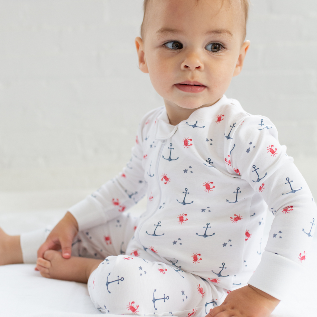 a baby wearing Nautical Crab Zipper Romper