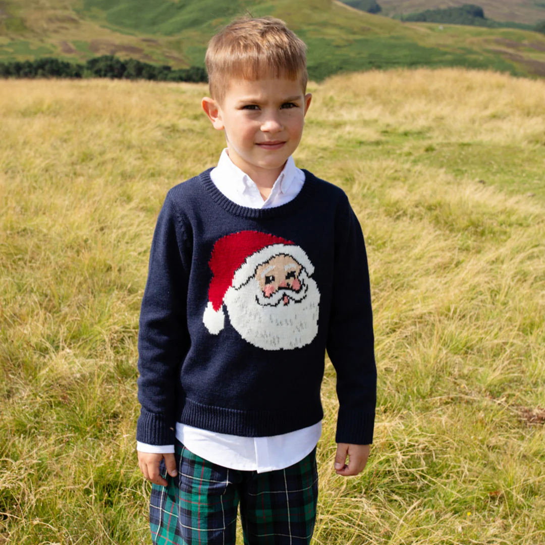 a boy wearing Oliver Sweater - Navy Santa