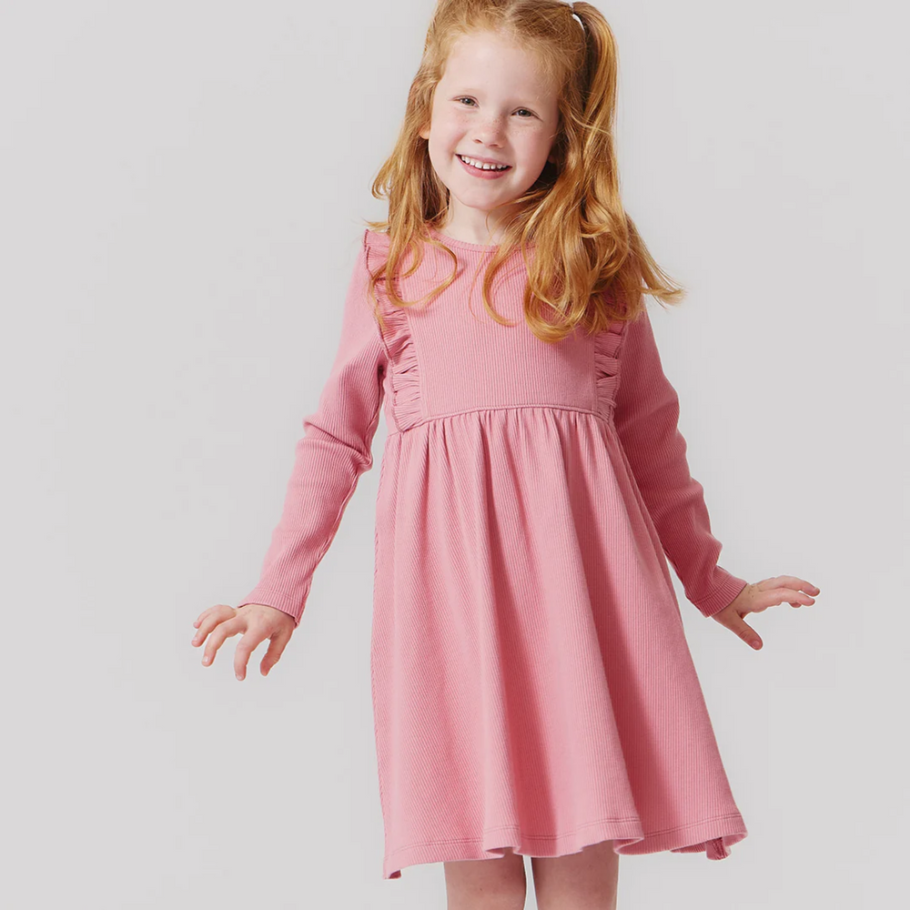 a little girl wearing Organic Kylie Rib Dress - Brandied Apricot