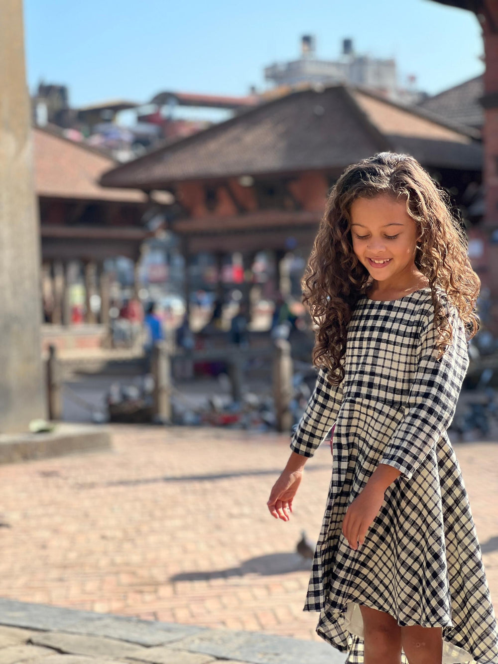 girl wearing plaid dress