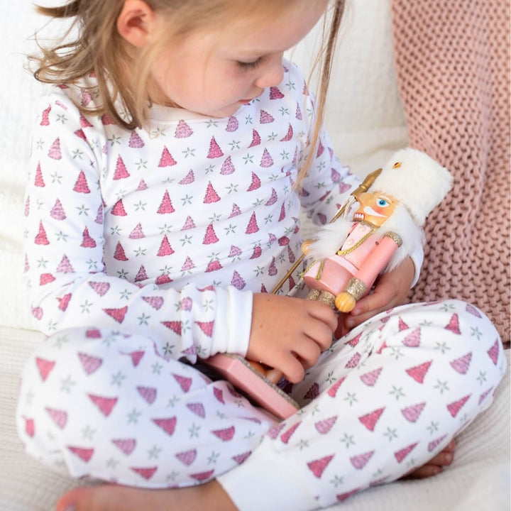 a girl wearing Holiday Tree Pajama Set in Pink Frost