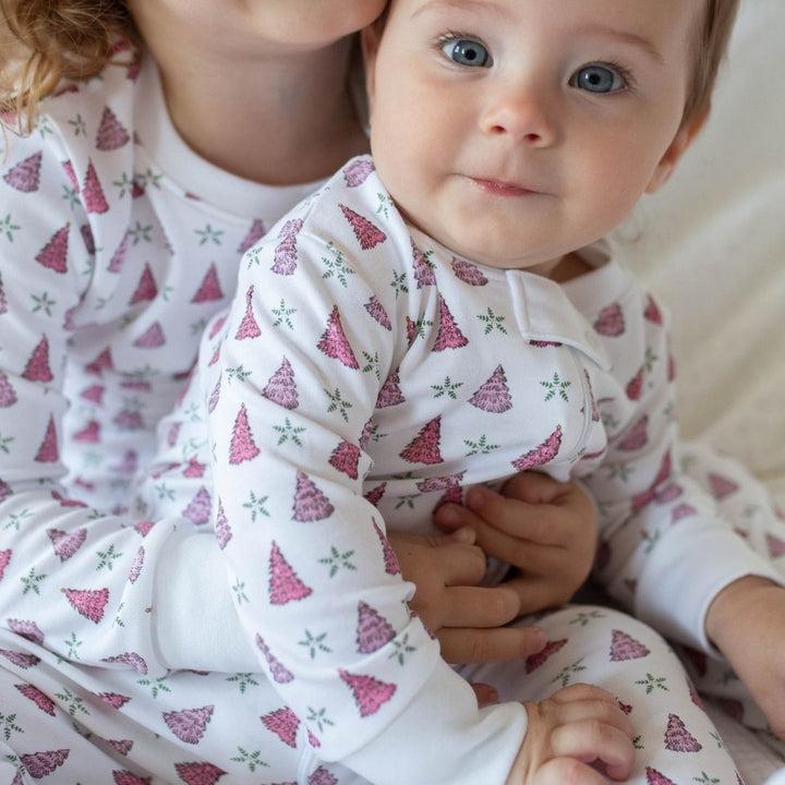 a kids wearing Holiday Tree Zipper Romper in Pink Frost