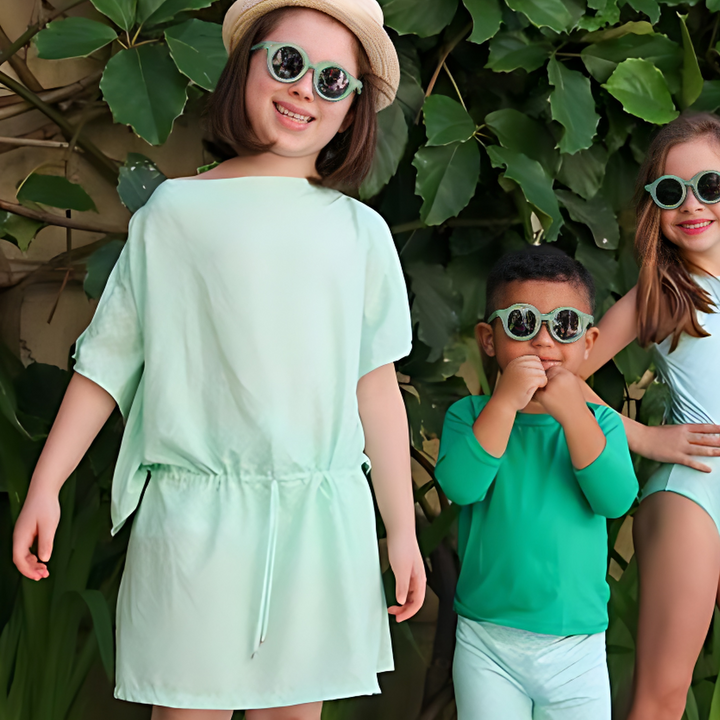  3 children standing at the leaves wearing Mint Vibes Cover Up