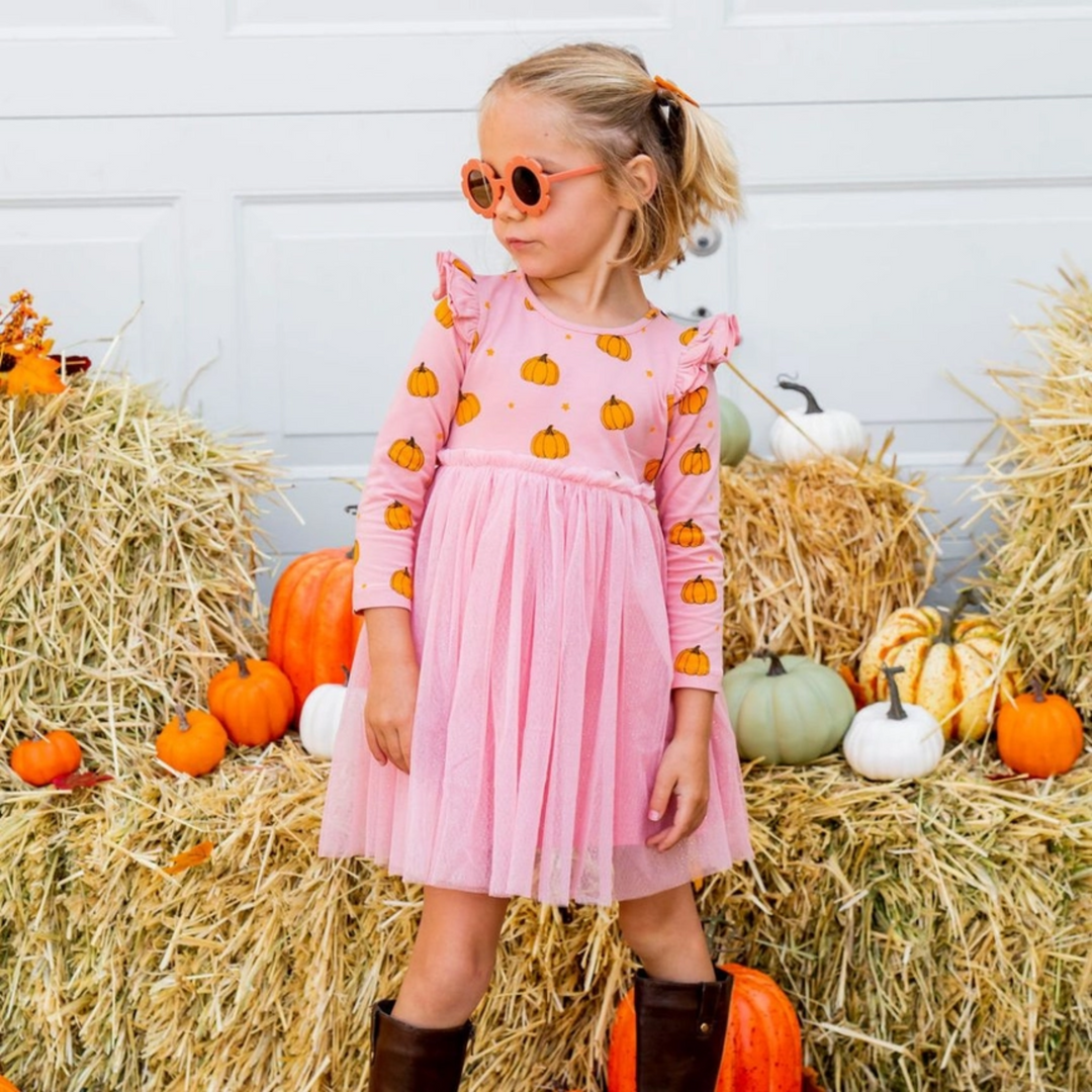 a girl wearing Pumpkin Blush Long Sleeve Tutu Dress