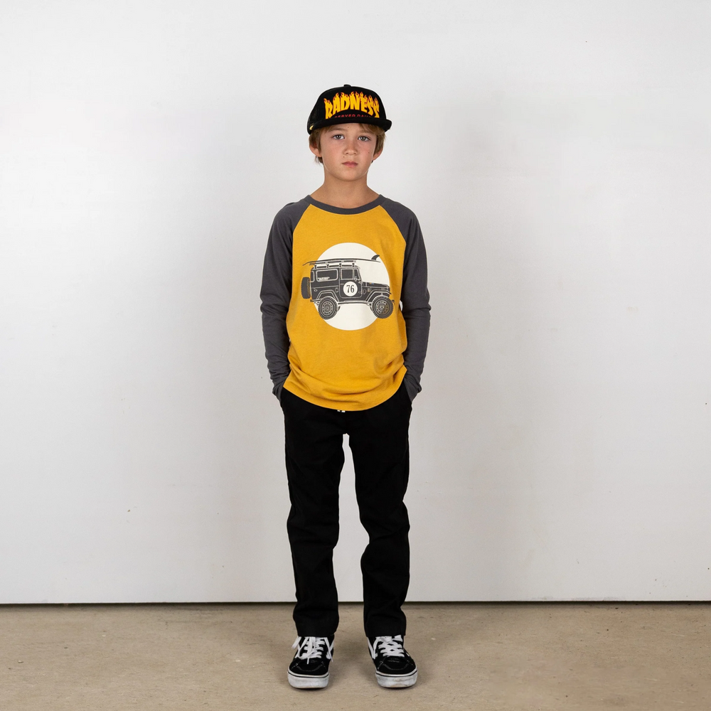 a boy wearing Rad Times Chino Pant in Vintage Black