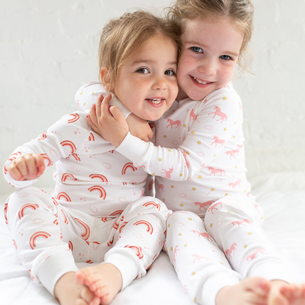 two little girls wearing Rainbow Cloud Pajama Set