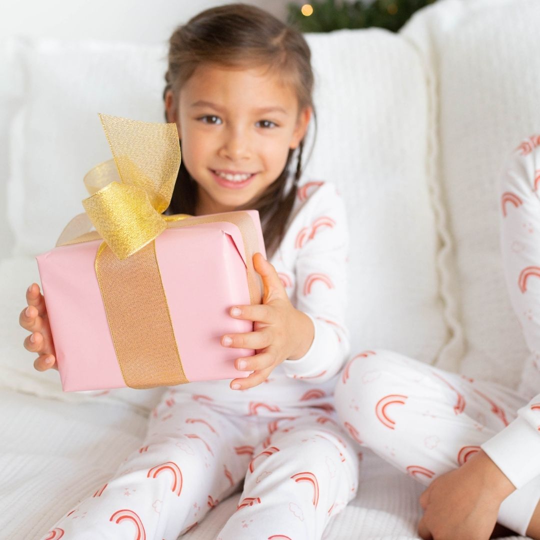 a girl wearing Rainbow Cloud Pajama Set