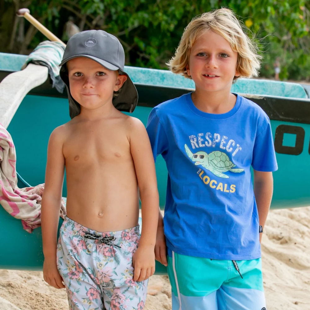 a boy wearing Respect the Locals Vintage Tee in Marina Blue