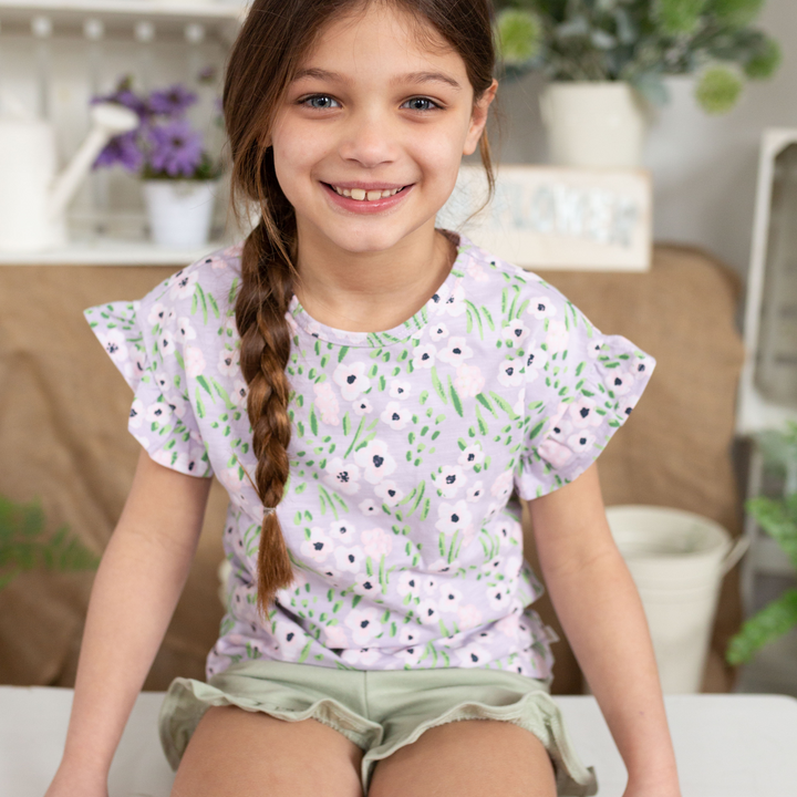 a girl wearing Rhea Ruffle Tee in Lavender Flowers