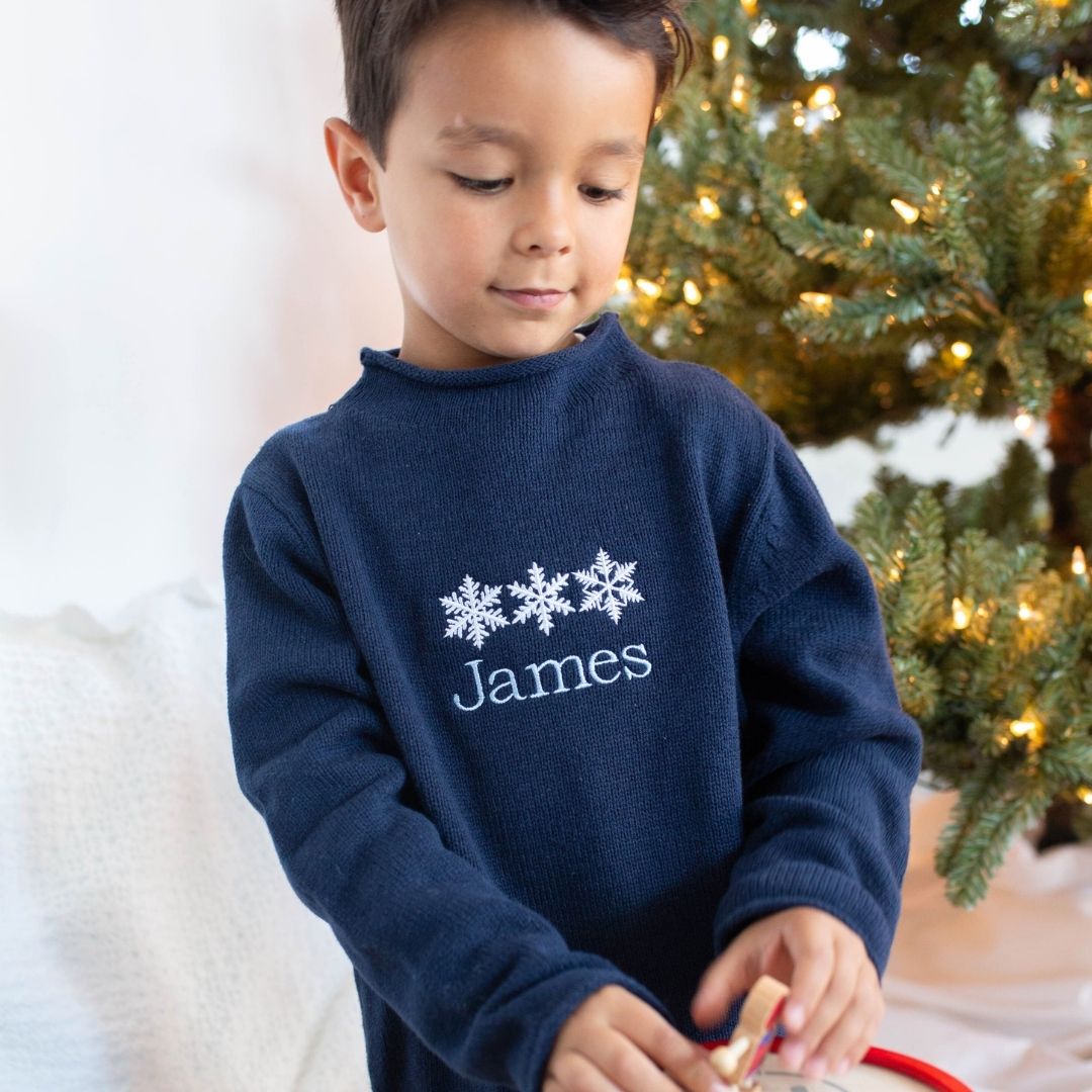 a boy wearing Rollneck Sweater in Black Iris (Navy)