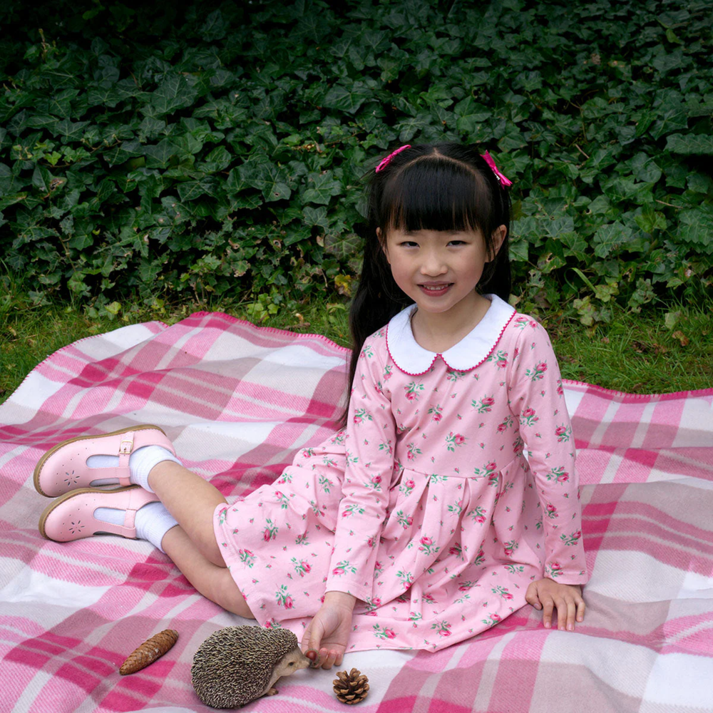 a girl wearing Rosebud Floral Jersey Dress in Pink