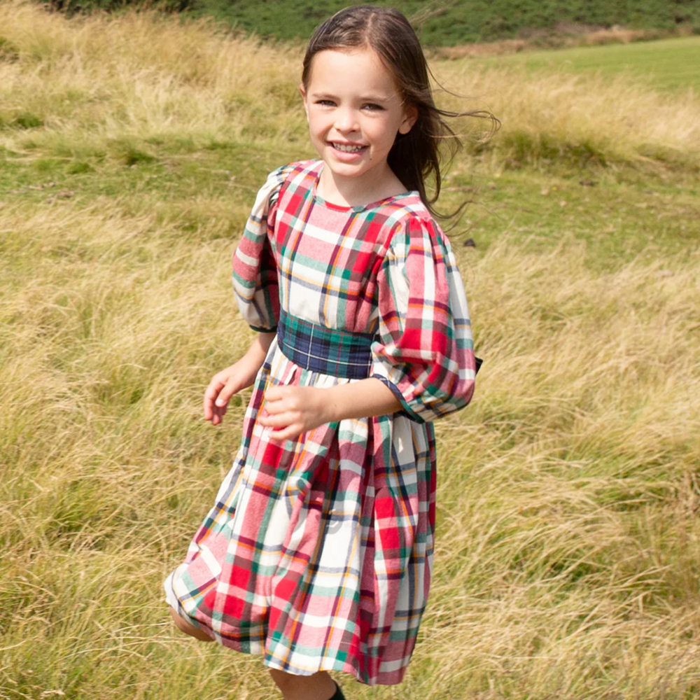 a girl wearing Ruby Dress - Holiday Tartan