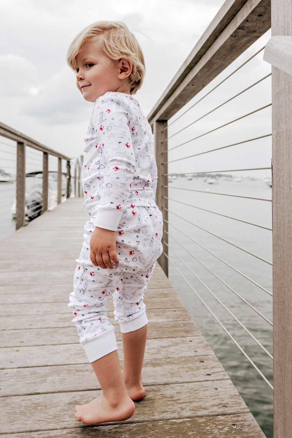 boy wearing coastal crab pajamas