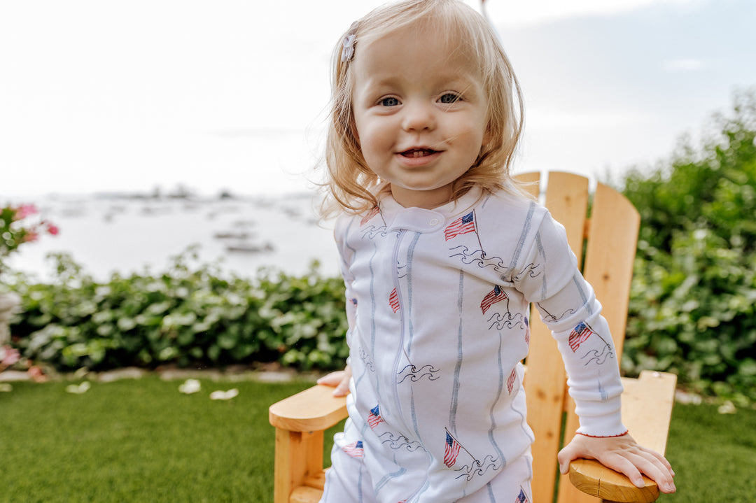  girl wearing land and sea zipper romper