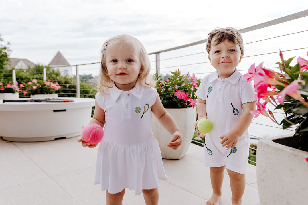 baby girl wearing tennis riley romper