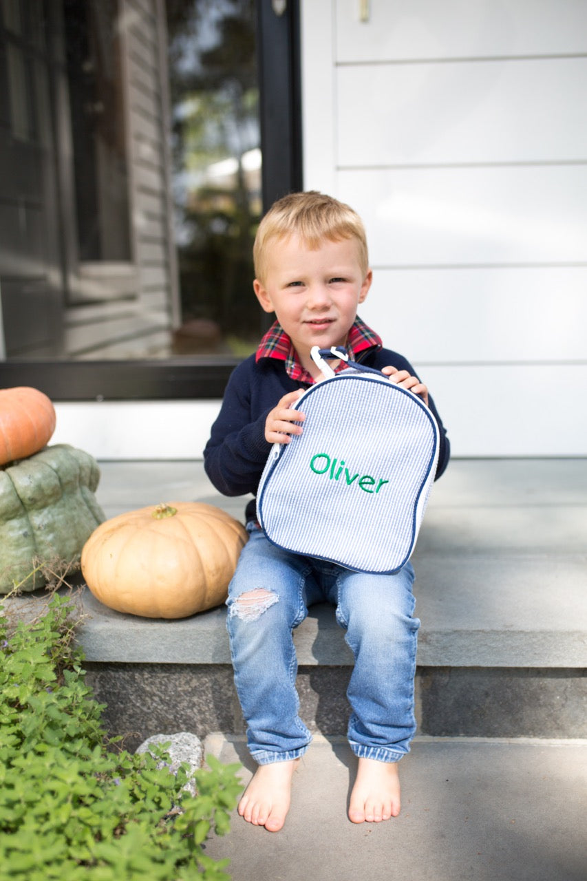 boy with monogrammed lunchbox