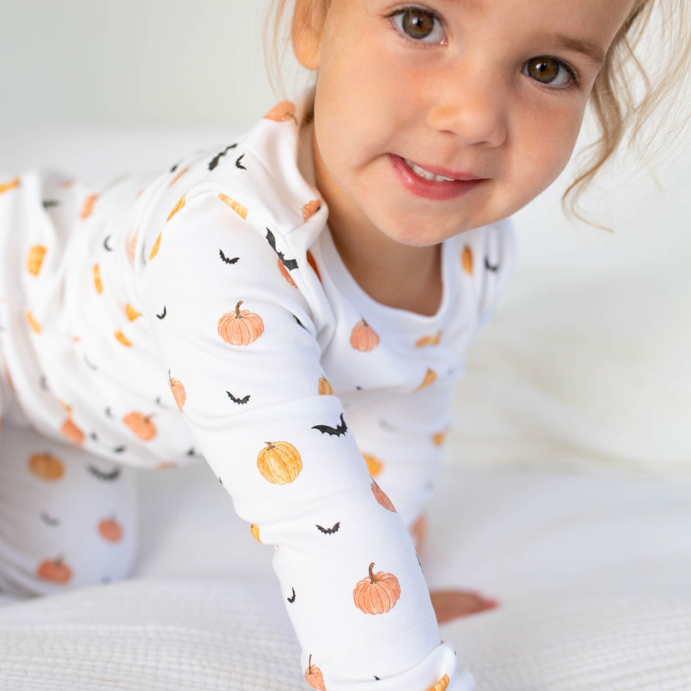 a girl wearing Scary Pumpkin Pajama Set