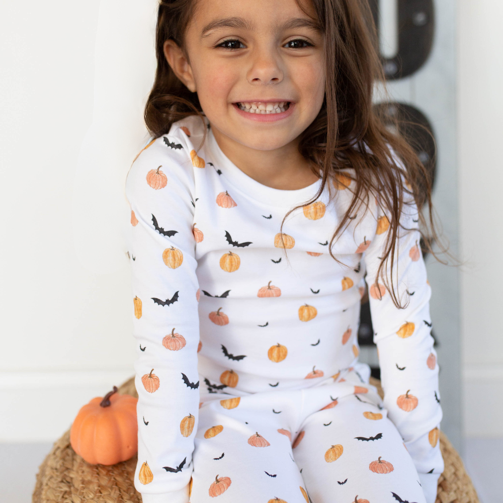 a girl wearing Scary Pumpkin Pajama Set