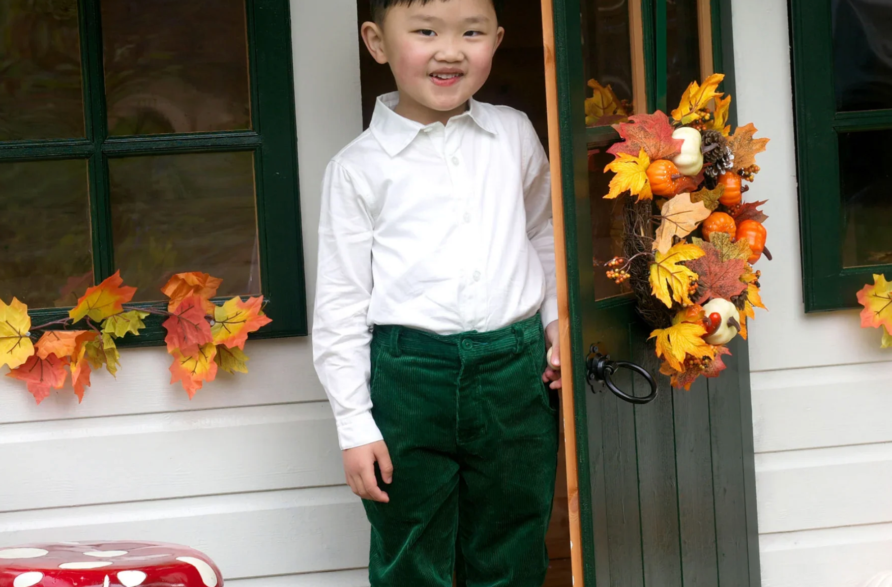 boy in front of house