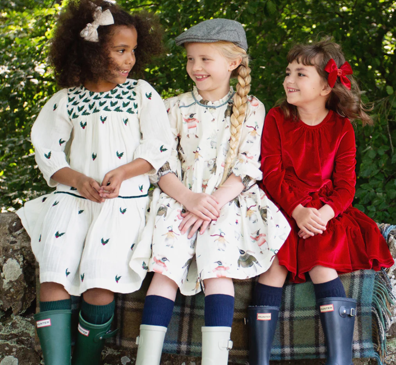 3 kids sitting on a bench