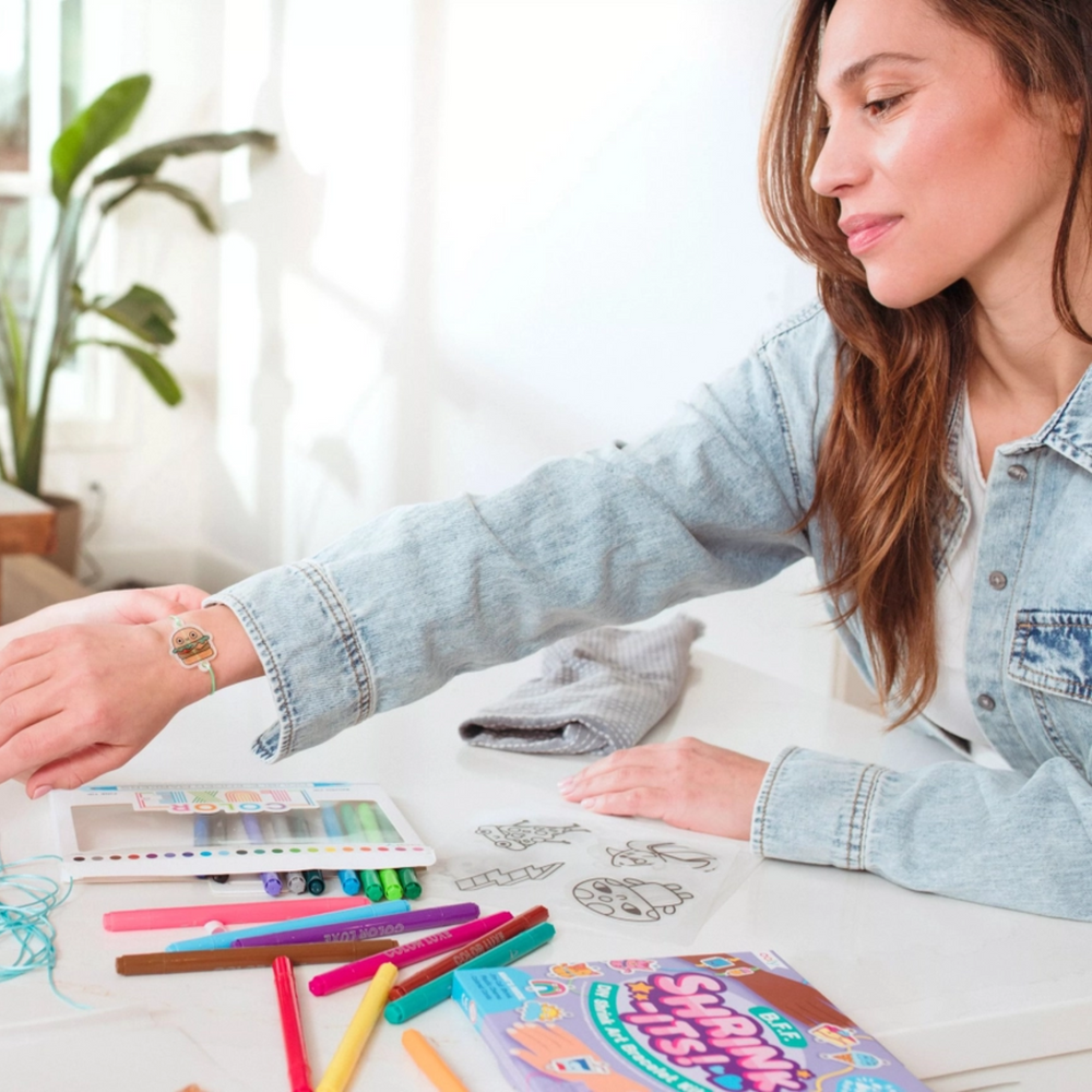 girls playing Shrink-Its! D.I.Y. Shrink Art Bracelets Kit - B.F.F.