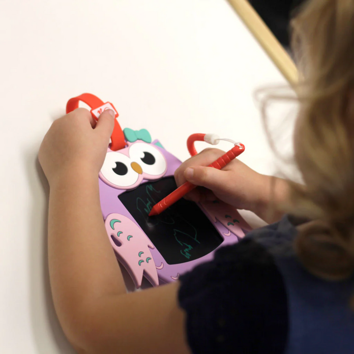 a girl using Sketch Pals Doodle Board: Izzy the Owl