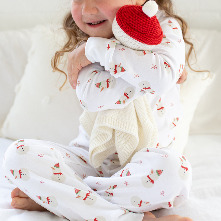 a little girl wearing Snowman Pajama Set