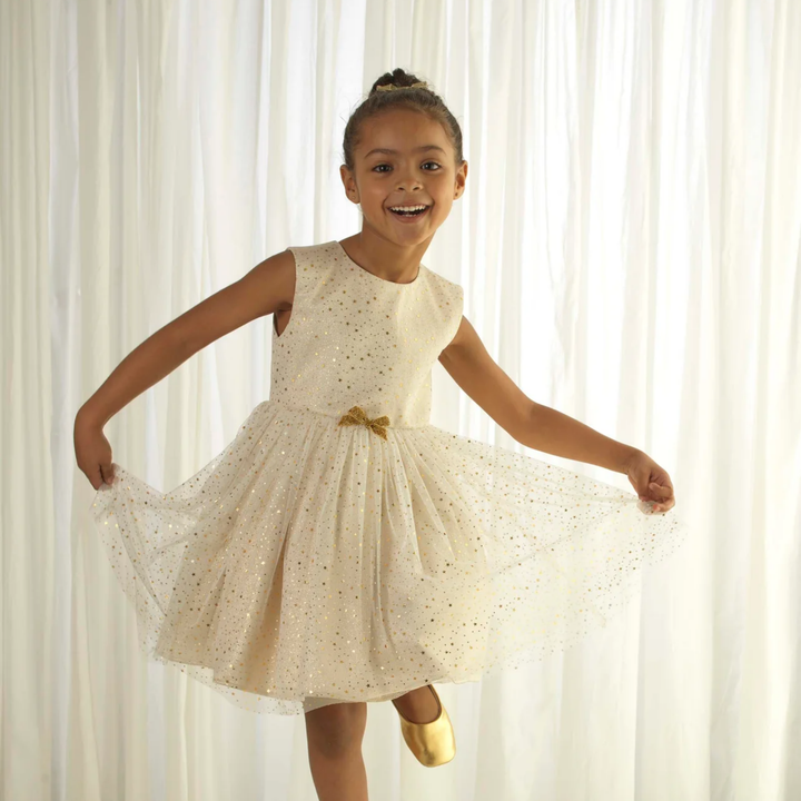 a girl wearing Sparkle Star Tulle Dress in Ivory