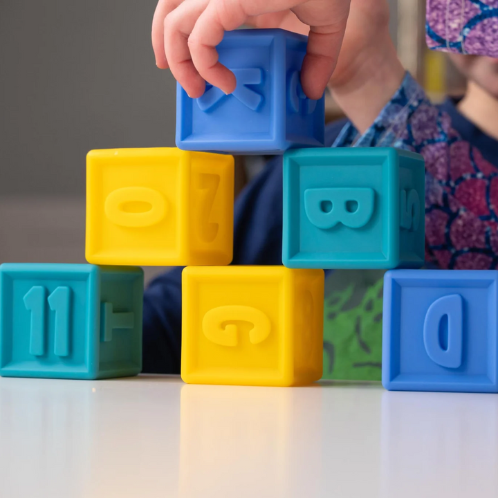 a kids playing Squeeze & Stack