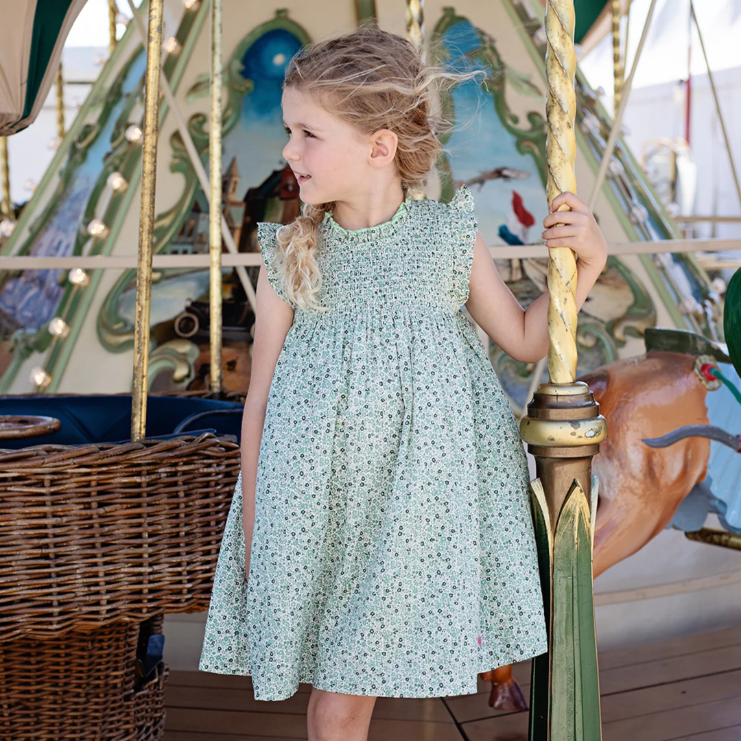 a girl wearing Stevie Dress - Green Mini Ditsy