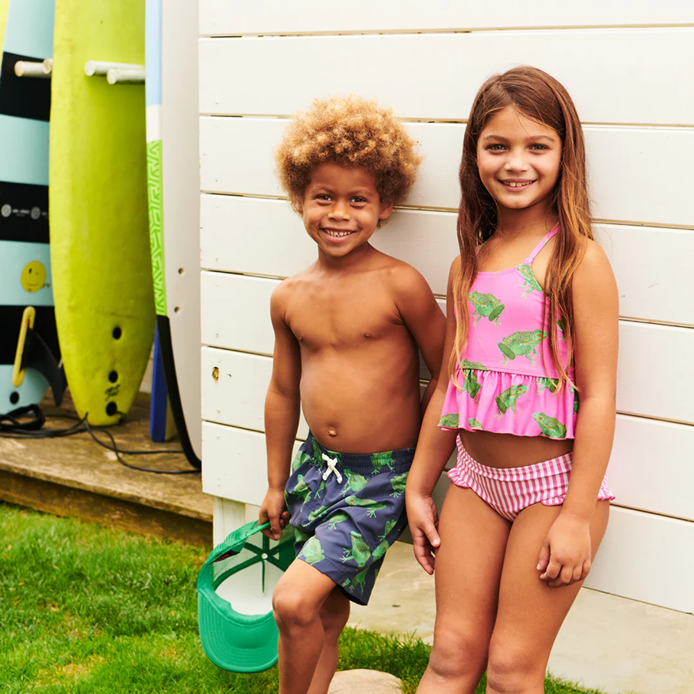 a boy wearing Swim Trunk - Navy Frogs