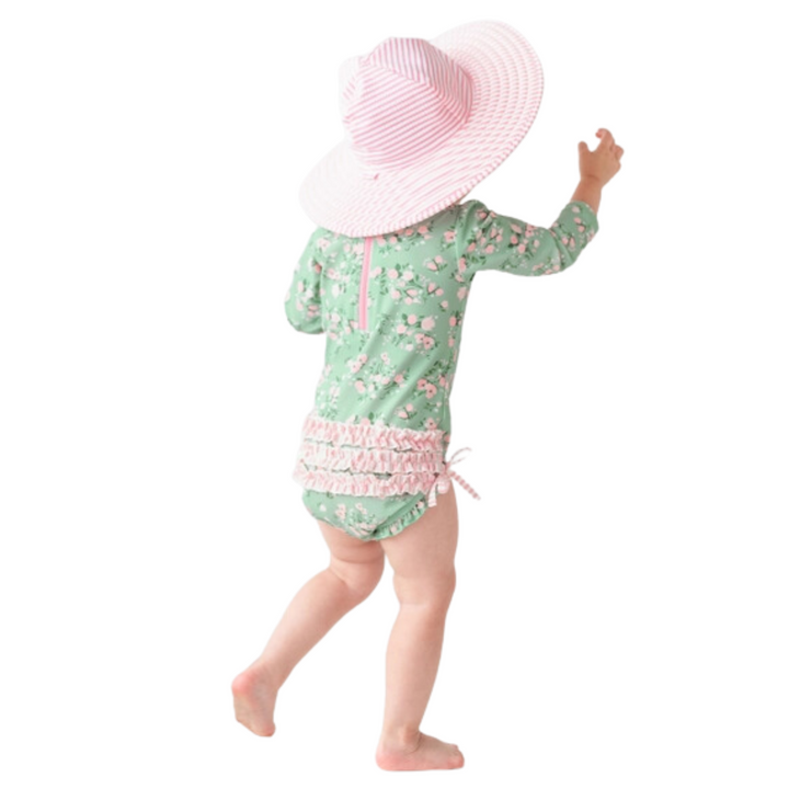 a little girl wearing Tea Roses Long Sleeve One Piece Rash Guard in Green