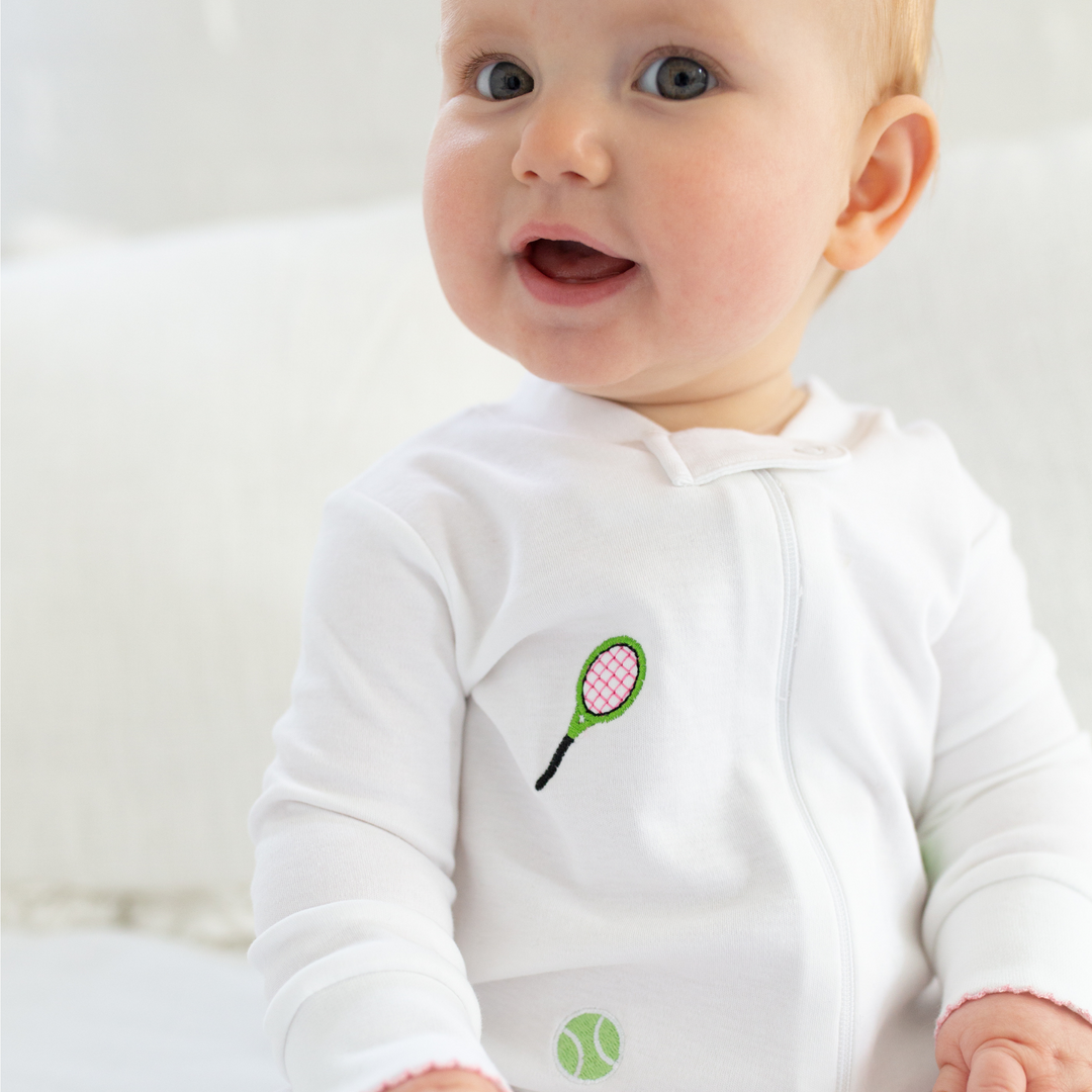 a baby wearing Tennis Embroidered Zipper Romper in Pink