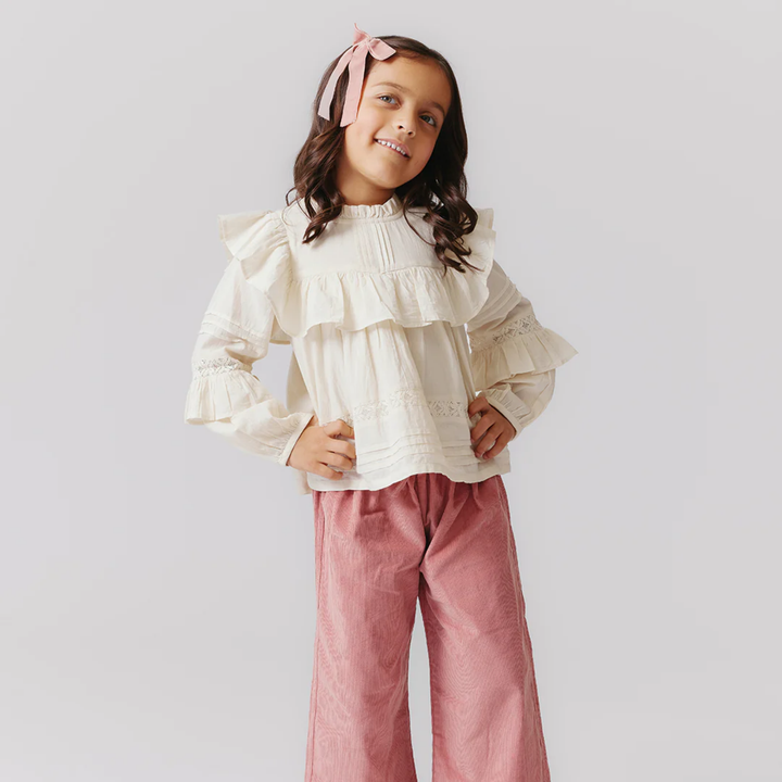 a girl wearing Theodore Pant - Dusty Pink