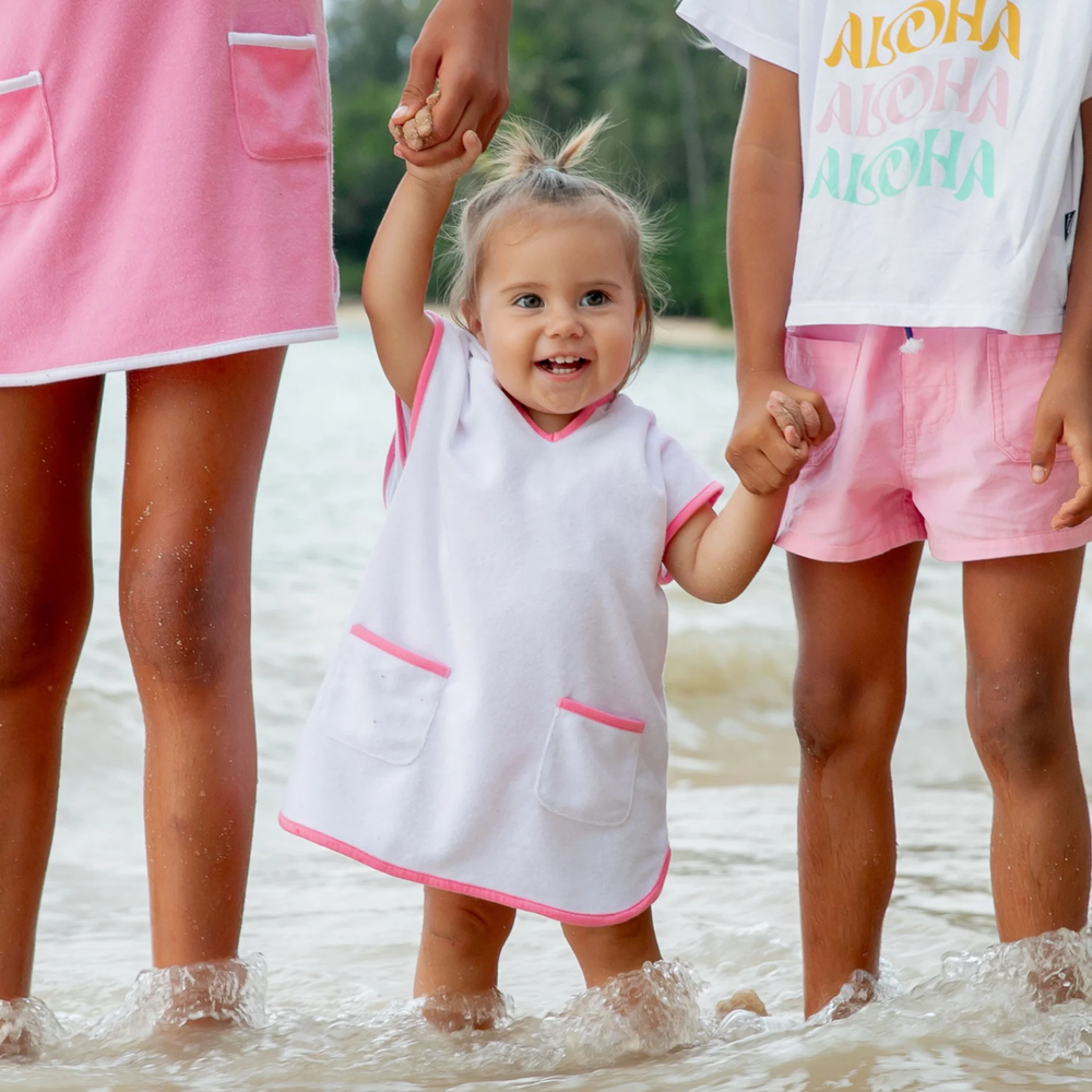 a baby wearing Tulum Terry Baby Romper in White