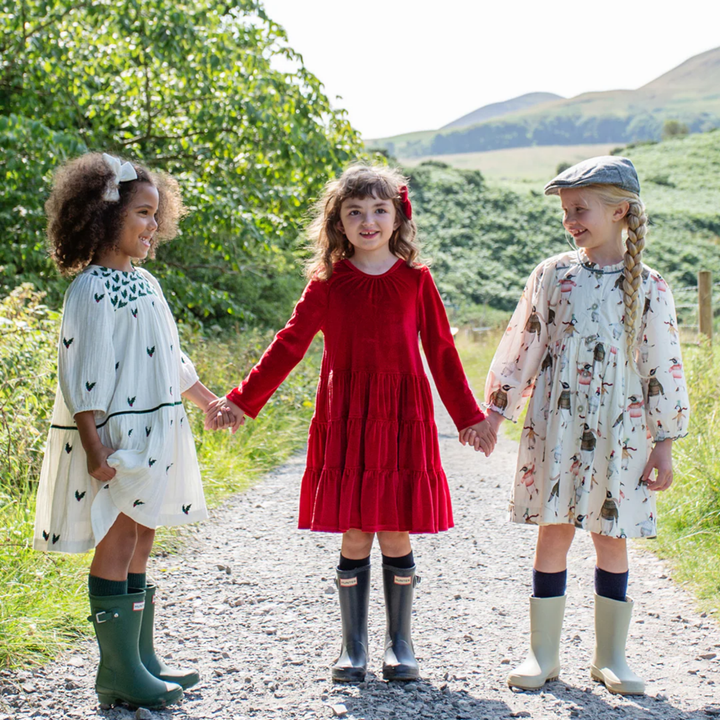 a girl wearing Velour Pearl Dress - Red